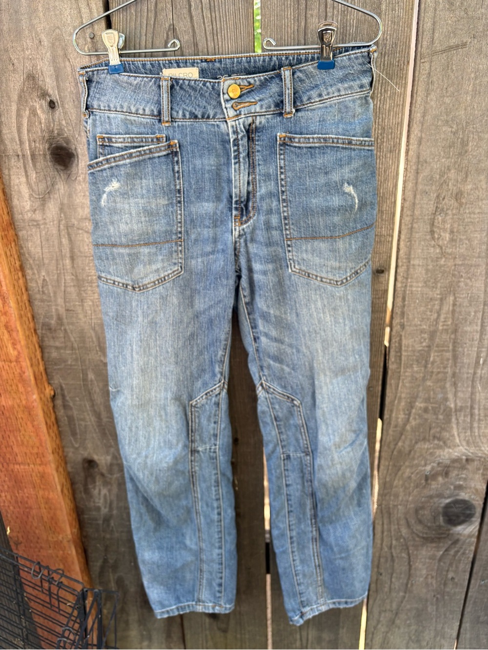 Anthropologie Pilcro The Wanderer Relaxed Jeans in a light blue denim wash.